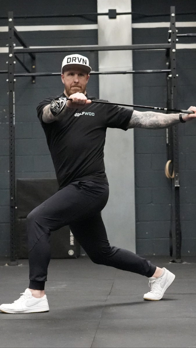 Michael Dennington coaching on a Golf fitness facility floor