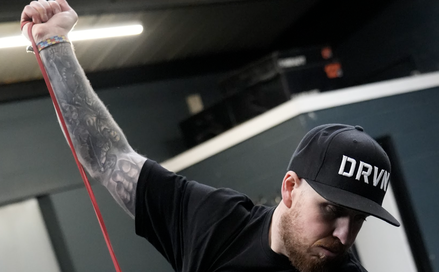 DRVN Certified Pro training with resistance band