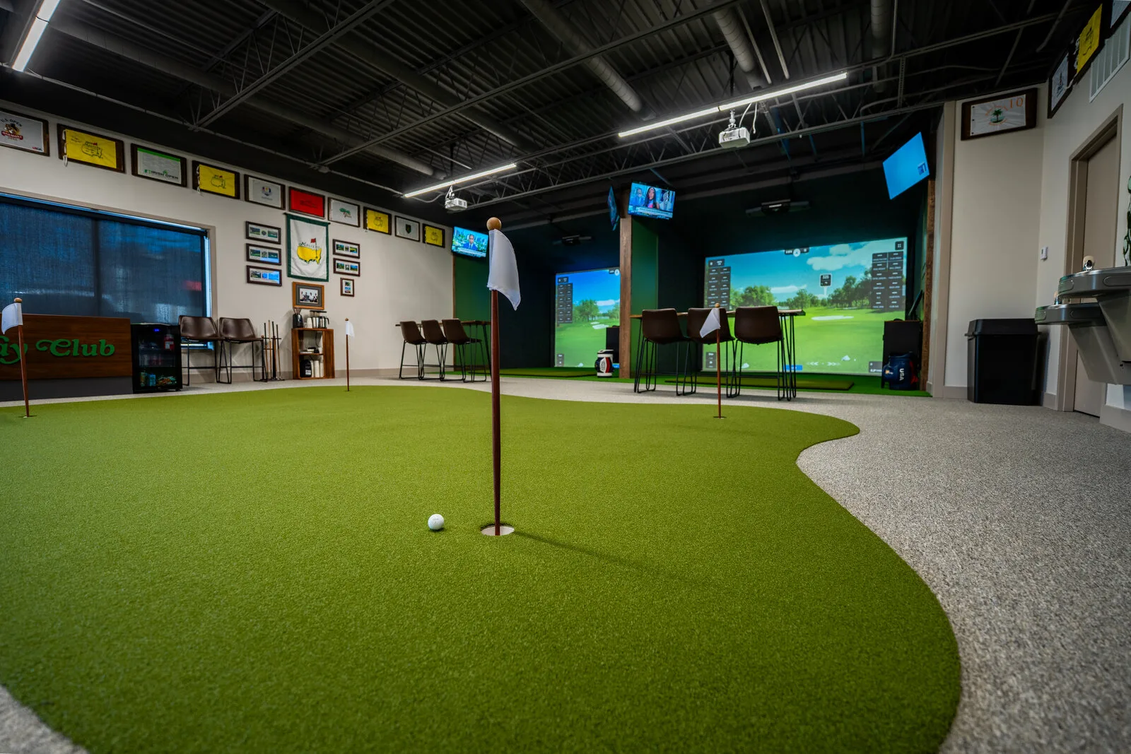 The putting green inside Fairway Club's four-bay simulator studio