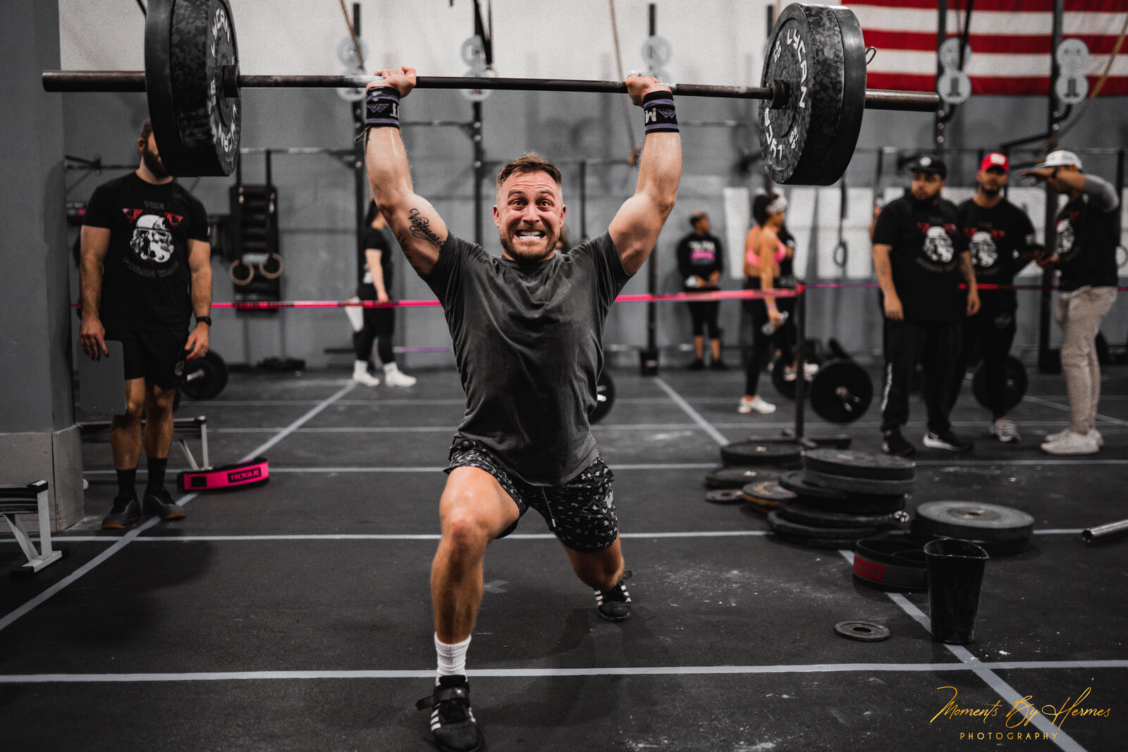 Zac Ansaldo, owner of Florida Athletic Club in Sarasota, Florida, locking out an overhead barbell jerk during an Olympic weightlifting competition